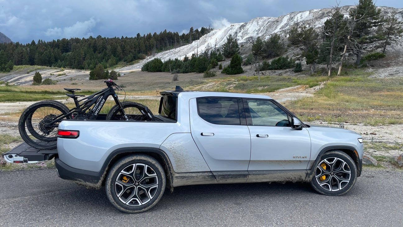 Two bikes in the back of a Rivian R1T truck bed using RIDE88 QR3 Bike Racks.