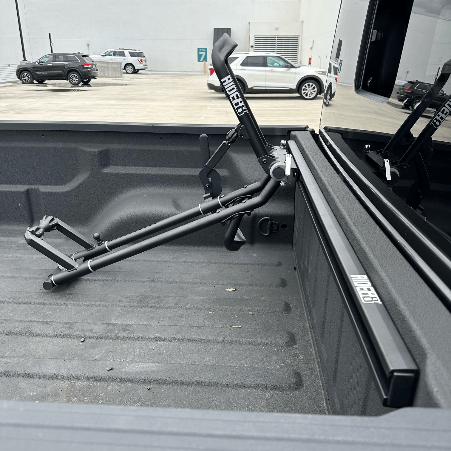 Bed view of a bike in the bed of a truck using the QR3 bike rack for Jeep Gladiator.