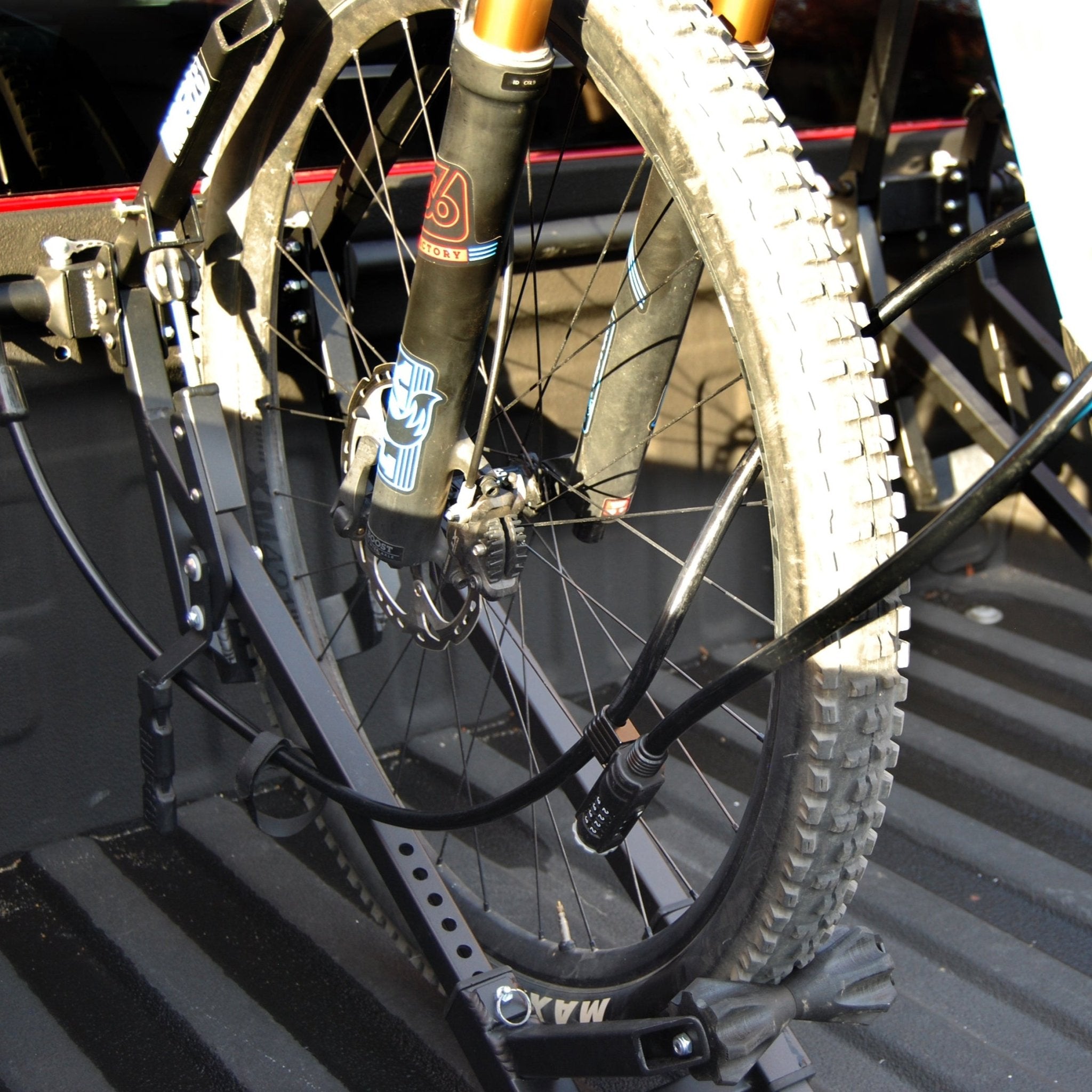RIDE88 Cable lock attached to a mountain bike's frame and the Telescopic Crossbar.