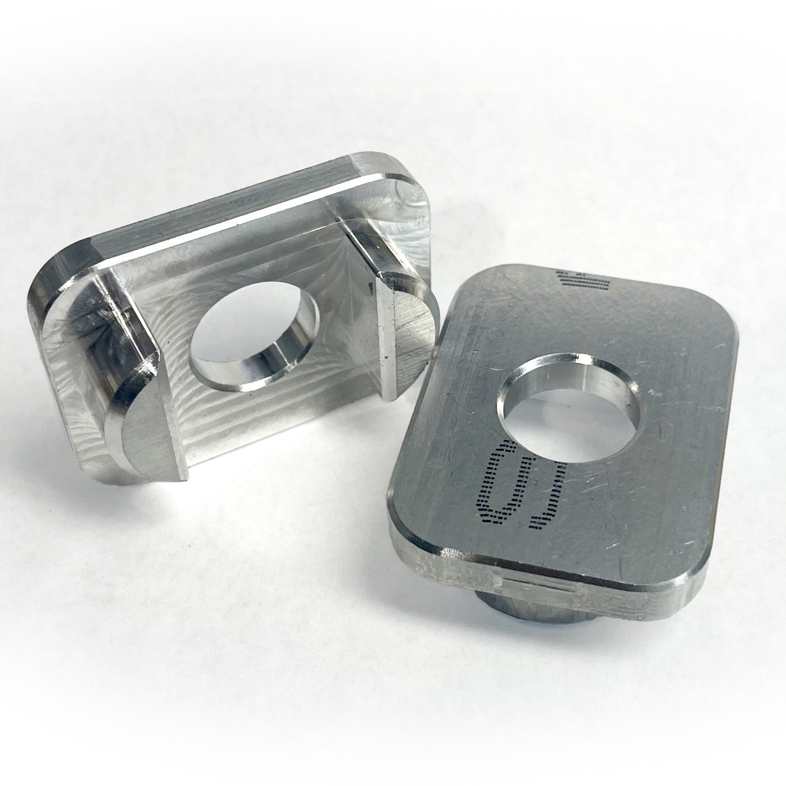 Two custom aluminum inserts used to mount a Telescopic Crossbar to a Chevy or GMC truck bed.