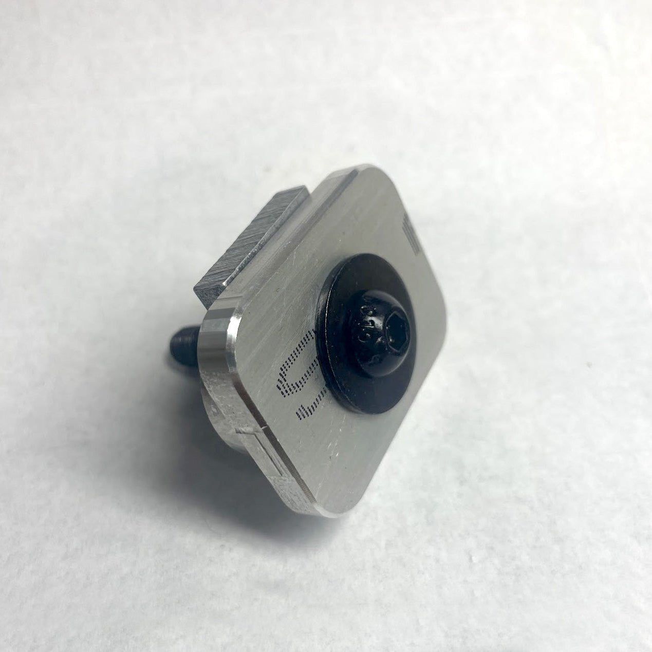 Custom aluminum insert and nut with a black bolt and washer, used for mounting RIDE88 utility track to a Chevy or GMC truck bed.