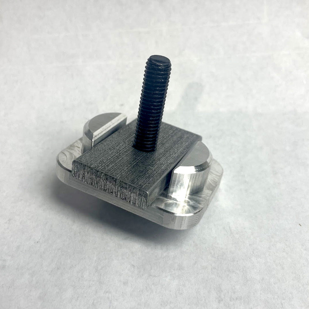 Custom aluminum insert and nut with a black bolt and washer, used for mounting RIDE88 utility track to a Chevy or GMC truck bed.