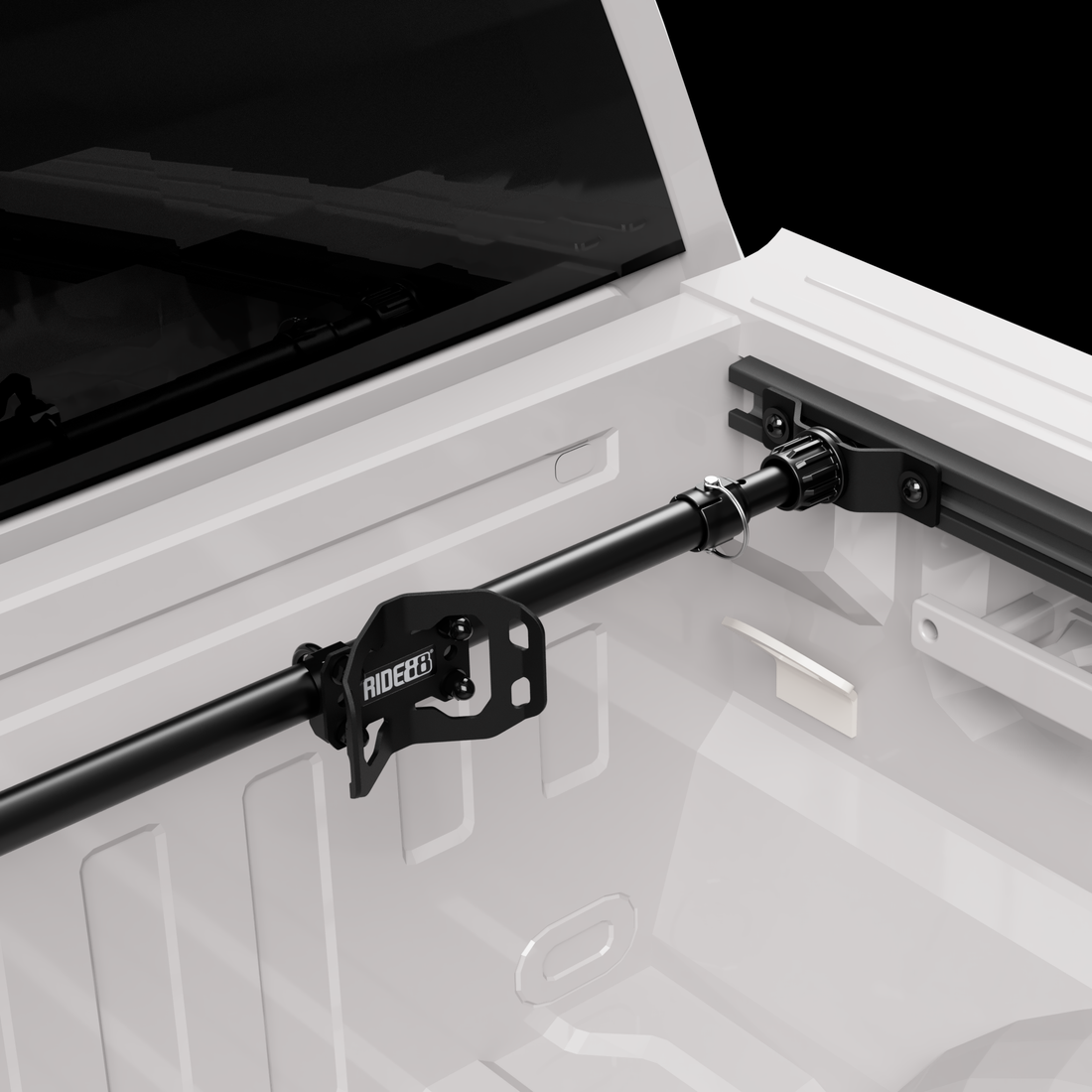 RIDE88 wheel chock mounted on a telescopic crossbar attached to the OEM side track in a pickup truck bed.