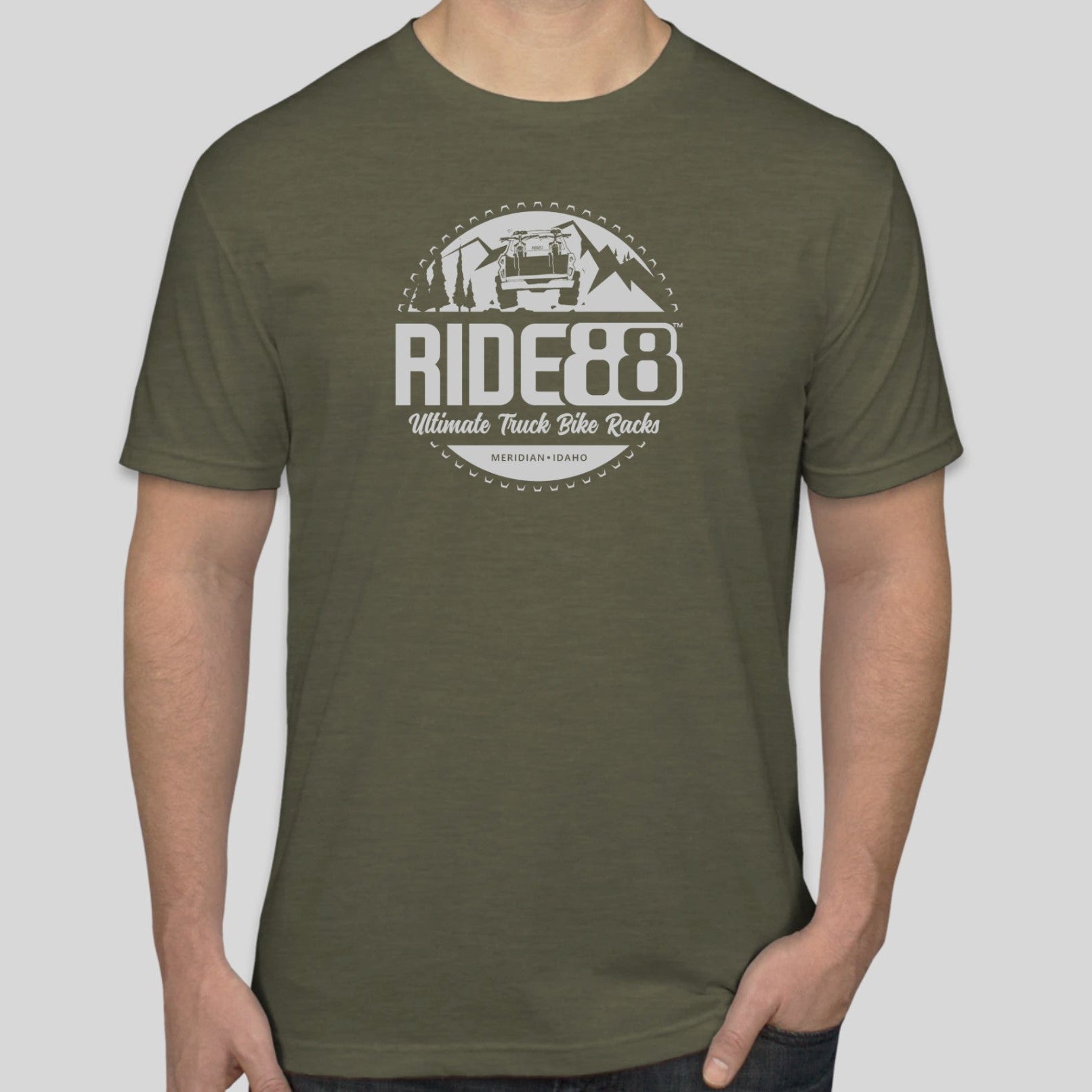 Olive green RIDE88 t-shirt featuring white graphic logo with a truck, mountains, and trees, reading “RIDE88 Ultimate Truck Bike Racks – Meridian, Idaho.