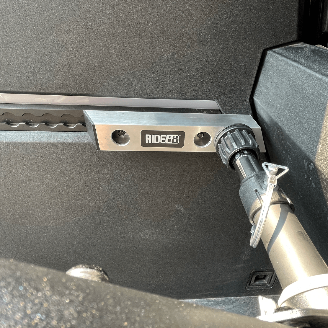 RIDE88 Cybertruck Side-Track Adapter mounted to the L-track of a Telsa Cybertruck with a Telescopic Crossbar attached.