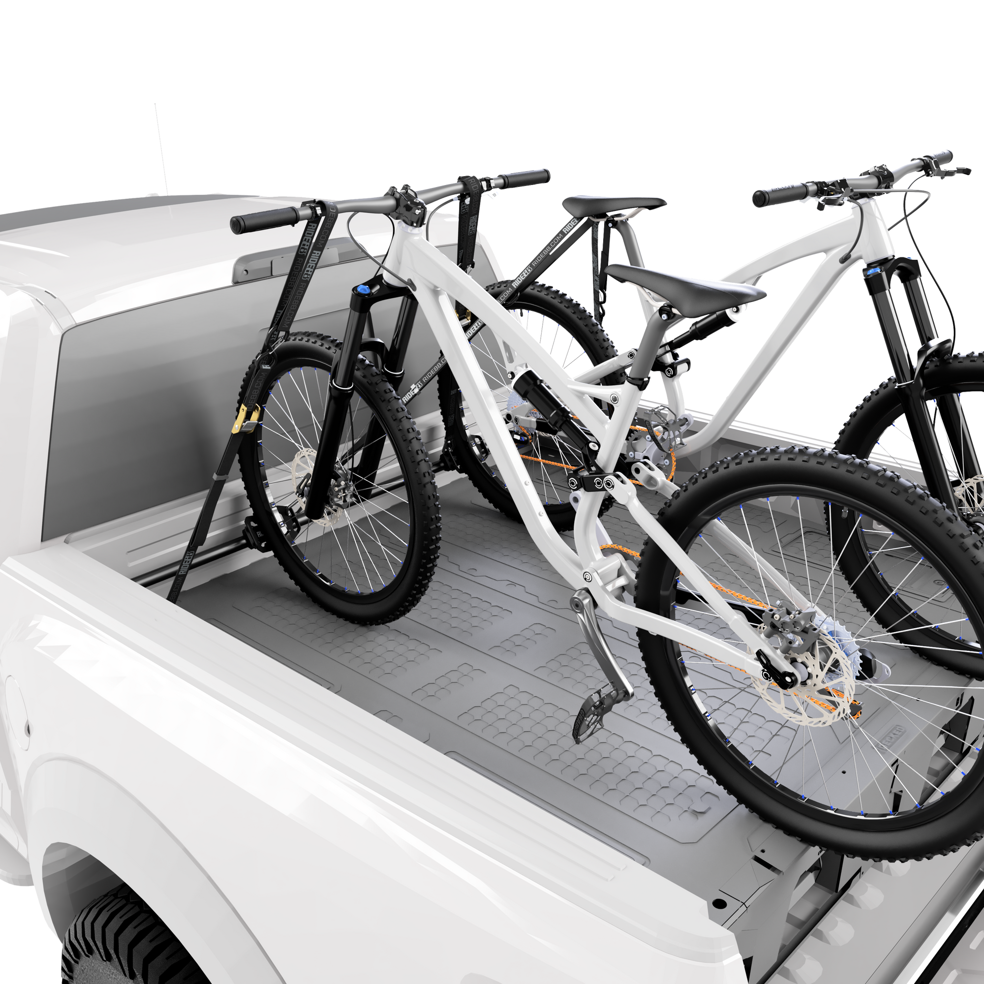 A truck with two bikes mounted in a RIDE88 Cinch Rack on top of a Decked drawer system.
