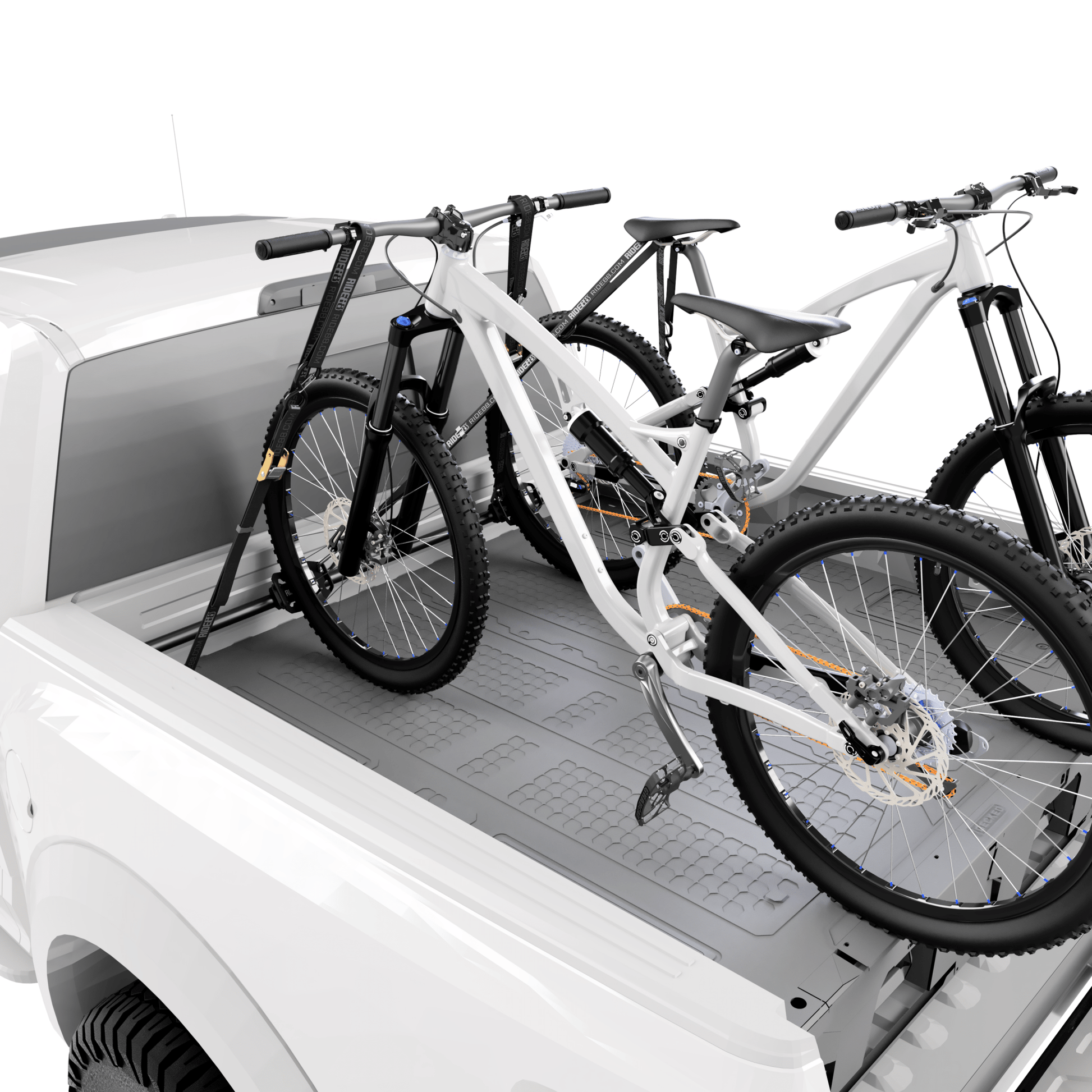 RIDE88 QR3 Cinch Rack holding two mountain bikes in a pickup truck bed above a truck bed storage box.
