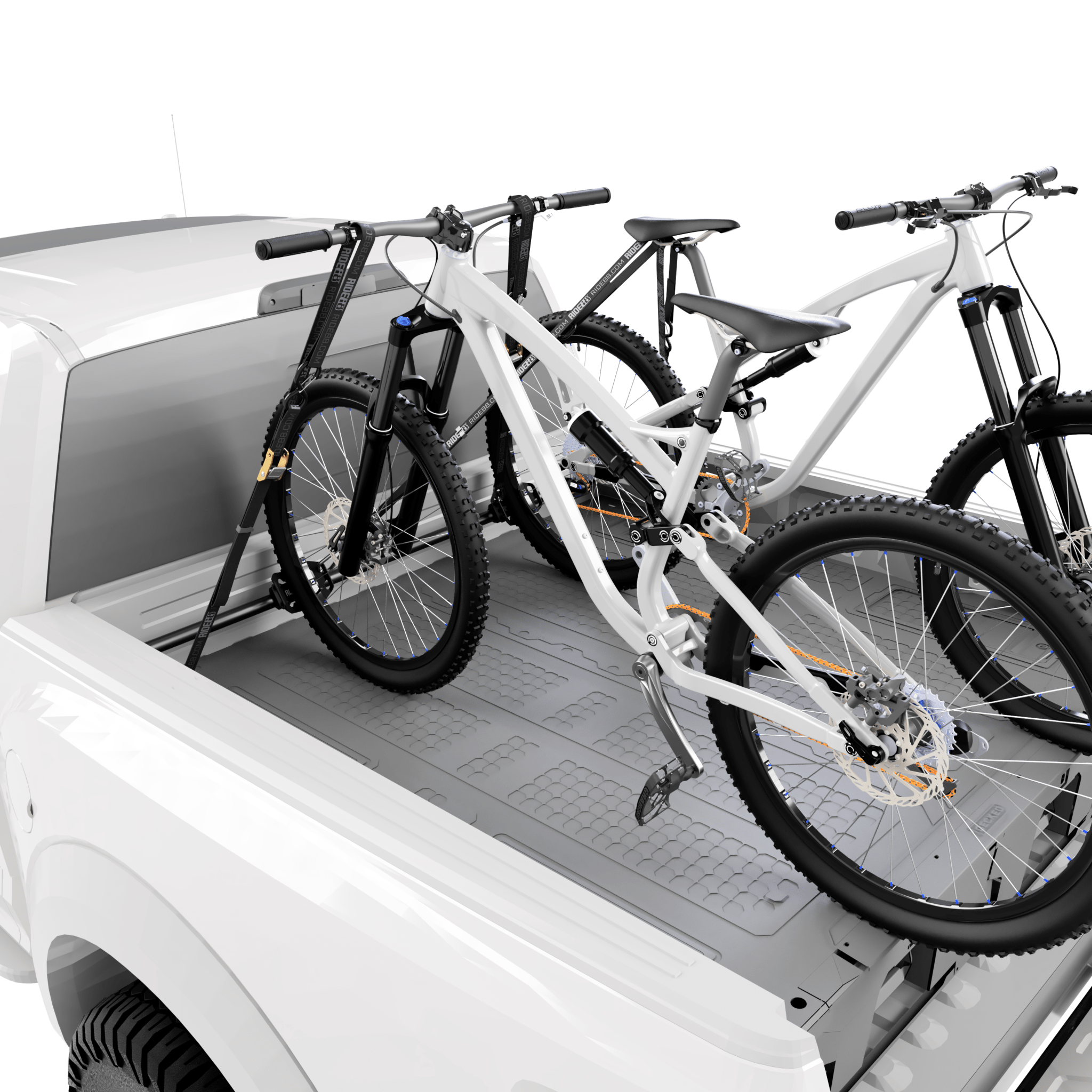 RIDE88 QR3 Cinch Rack holding two mountain bikes in a pickup truck bed above a truck bed storage box.