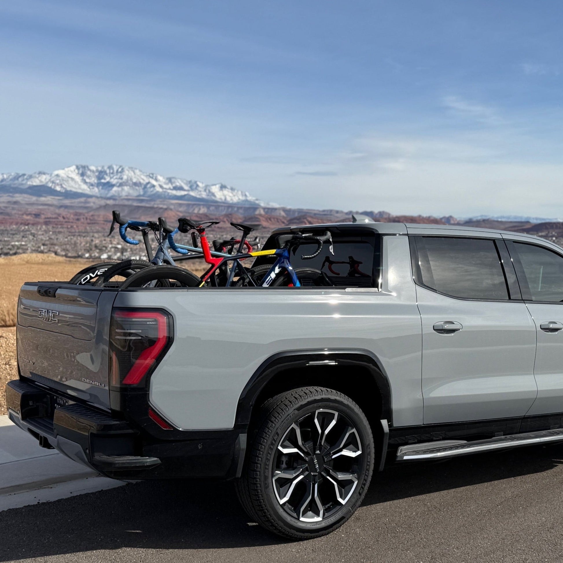 Bikes mounted in the bed of a truck using the QR3 Bike Rack for GMC Sierra EV and Chevy Silverado EV.