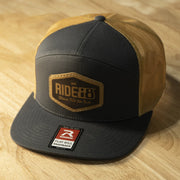 RIDE88 Gray and Old Gold trucker hat with brown leather patch logo reading “RIDE88 Ultimate Truck Bike Racks,” featuring flat bill and mesh back design.