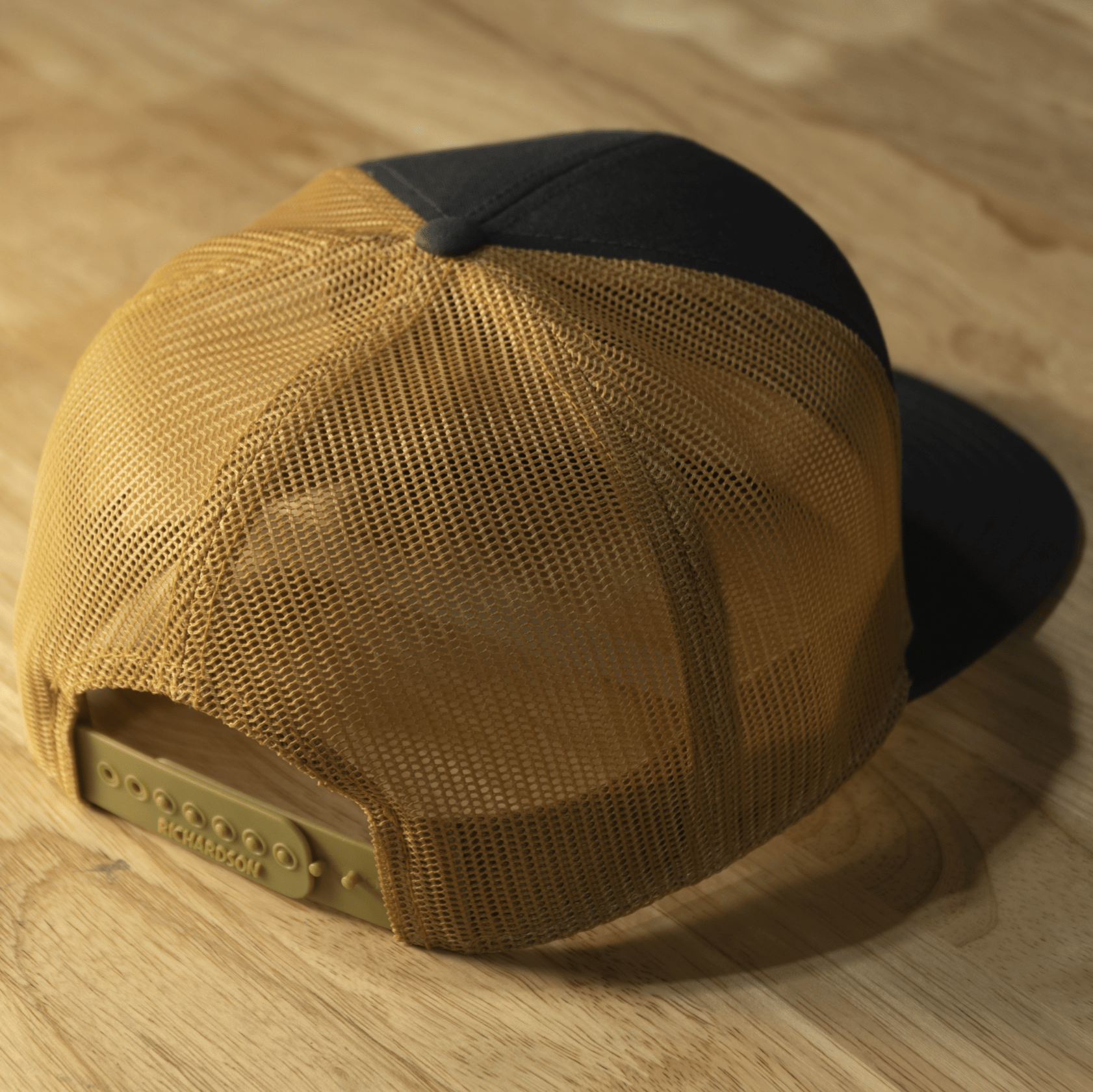 RIDE88 Gray and Old Gold trucker hat with brown leather patch logo reading “RIDE88 Ultimate Truck Bike Racks,” featuring flat bill and mesh back design.