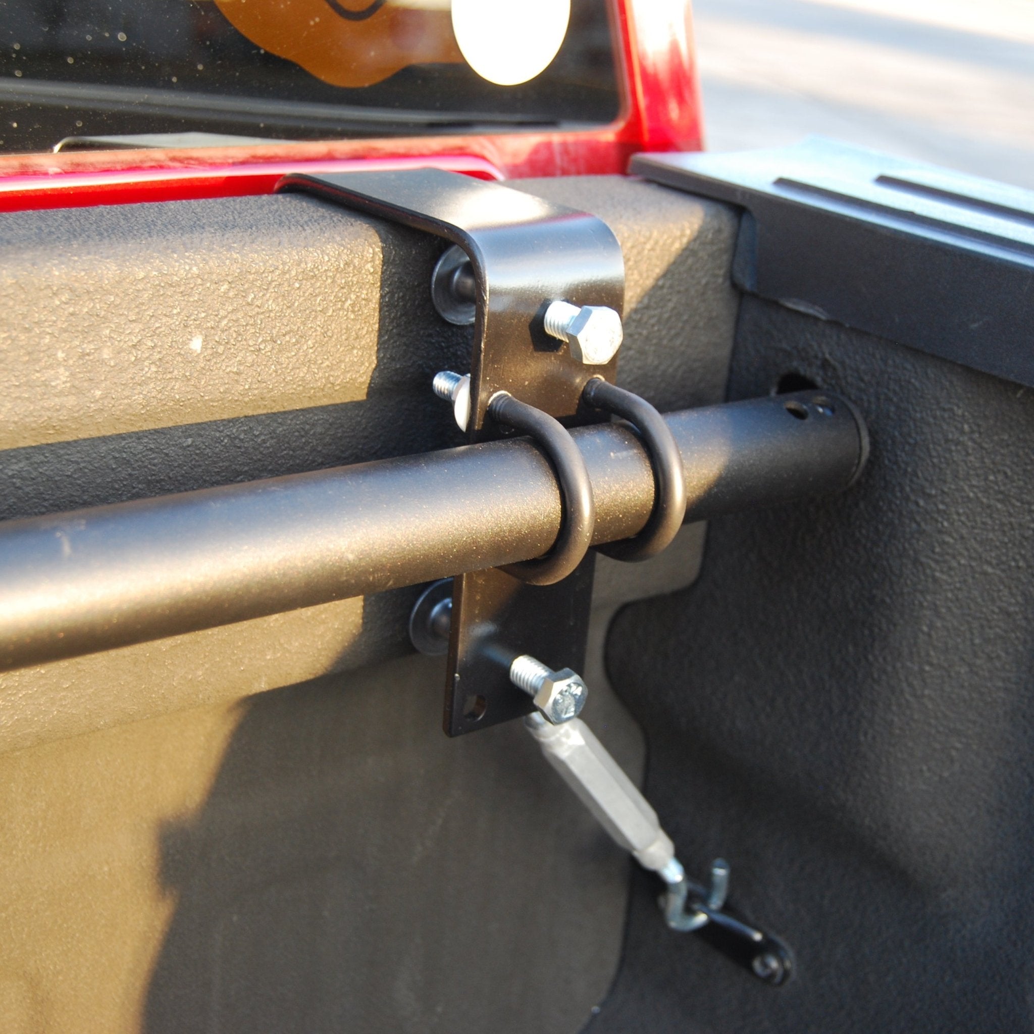RIDE88 Hanger Crossbar Bracket mounted to a truck bed, holding a crossbar.