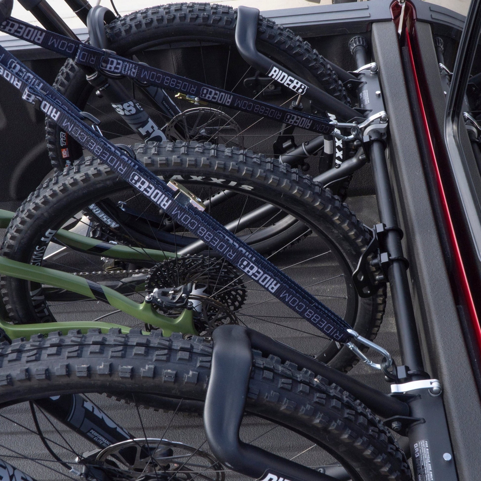 One RIDE88 Plus One Kit and two QR3 Bike Racks, all holding bicycles in a truck bed.