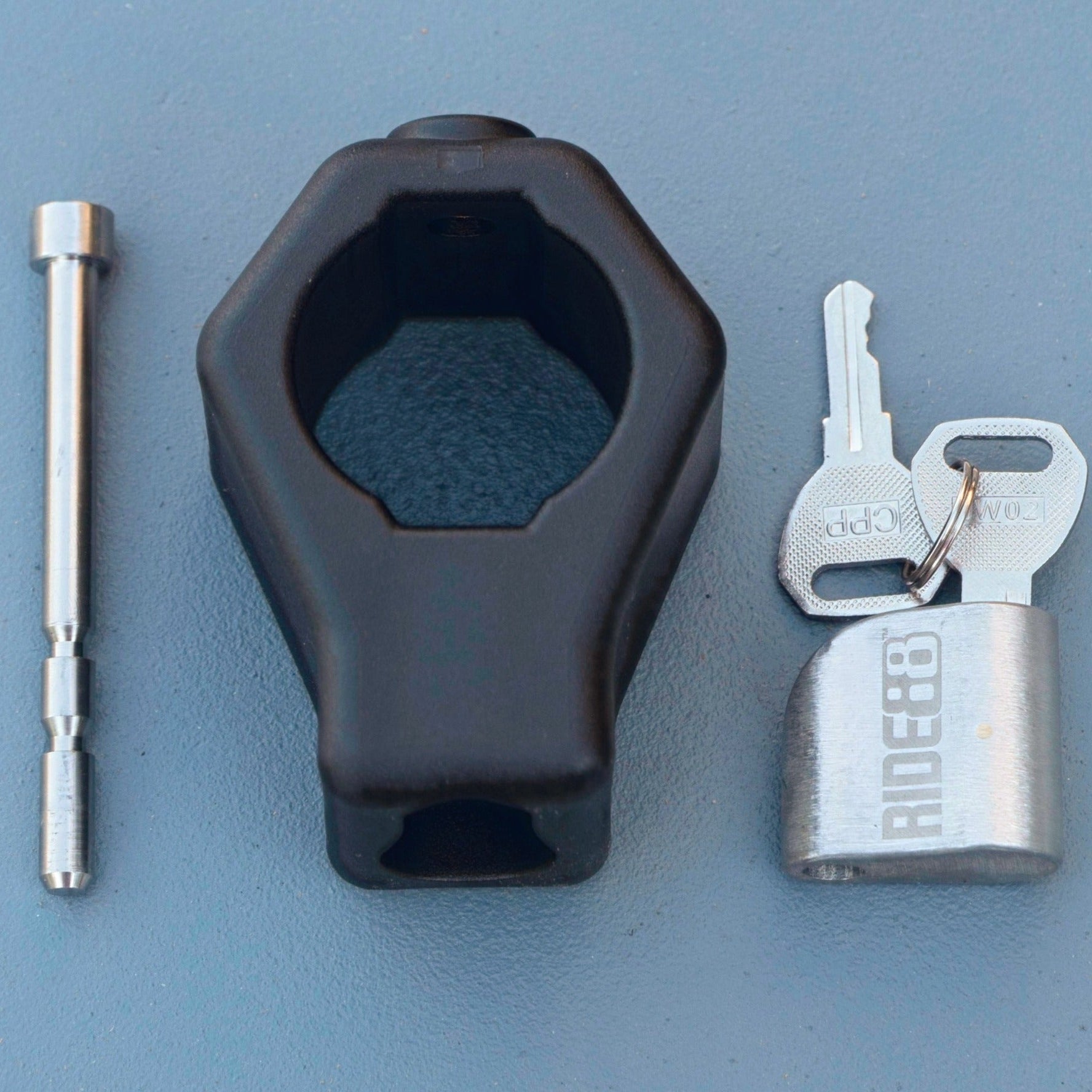 RIDE88 stainless steel locking pin, key, and fiberglass-reinforced nylon lock-housing set for securing Telescopic Crossbar, precision-machined for truck bed bike rack security.