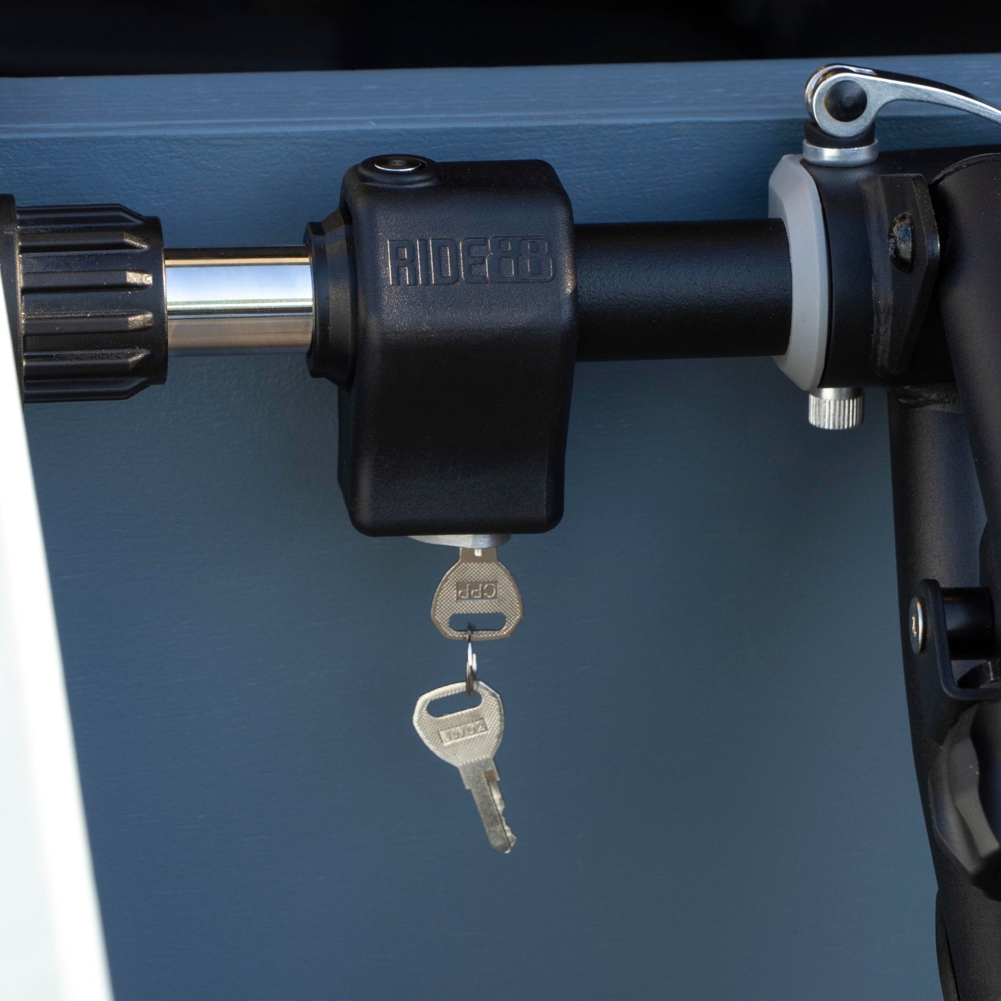 RIDE88 Premium Crossbar Lock mounted to a Telescopic Crossbar for truck bed bike racks.
