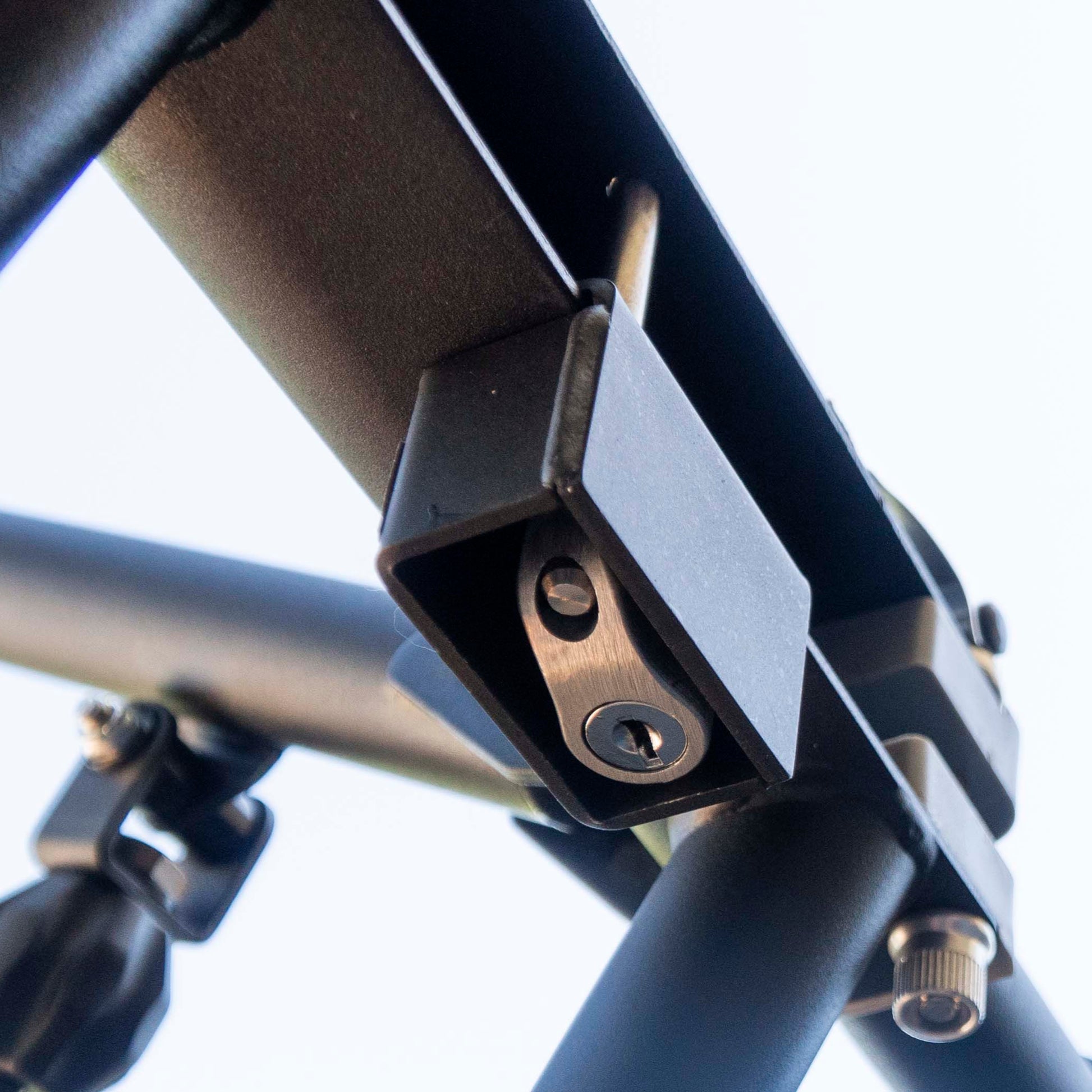 RIDE88 Premium QR3 Rack Lock bottom view showing stainless steel lock mechanism nestled inside of steel lock housing.