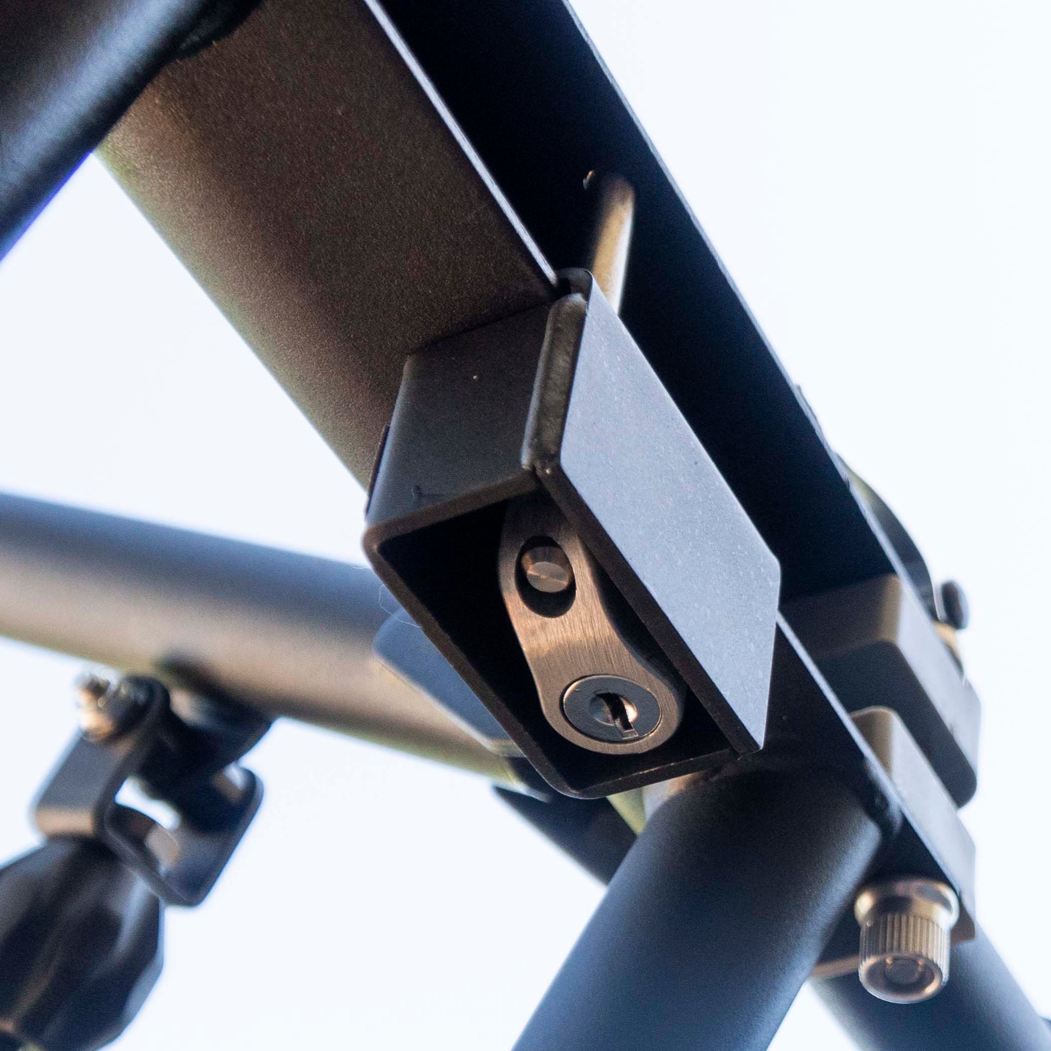 RIDE88 Premium QR3 Rack Lock bottom view showing stainless steel lock mechanism nestled inside of steel lock housing.