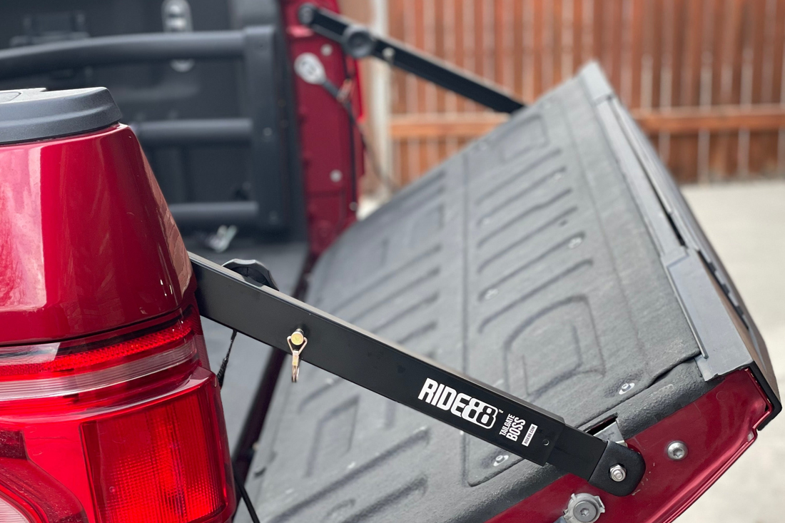 RIDE88 Tailgate Boss Pro installed on a truck holding a tailgate up at 45 degrees.