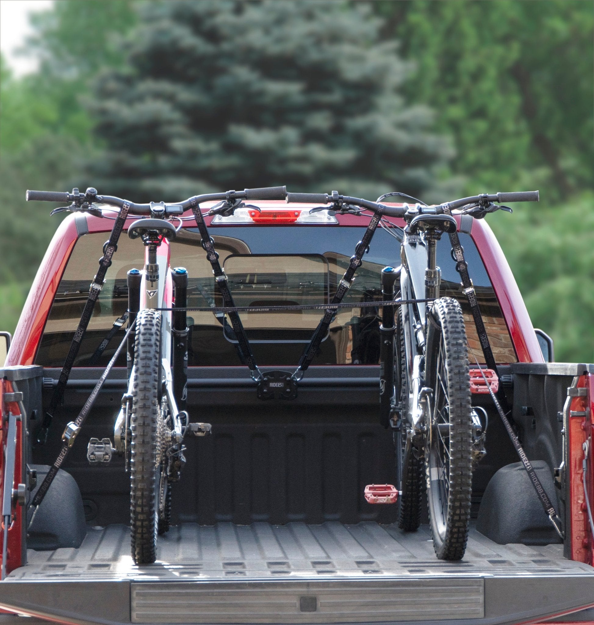 2 bikes mounted to the bed of a truck using a RIDE88 Telescopic Cinch Rack.
