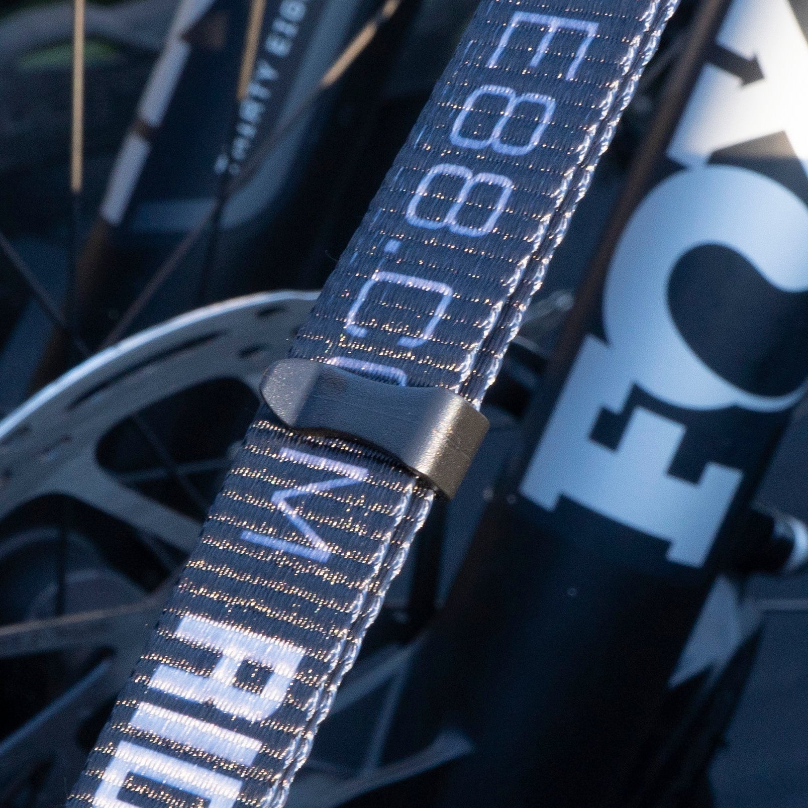 RIDE88 Tie-Down Strap close-up showing plastic organizer for excess strap.