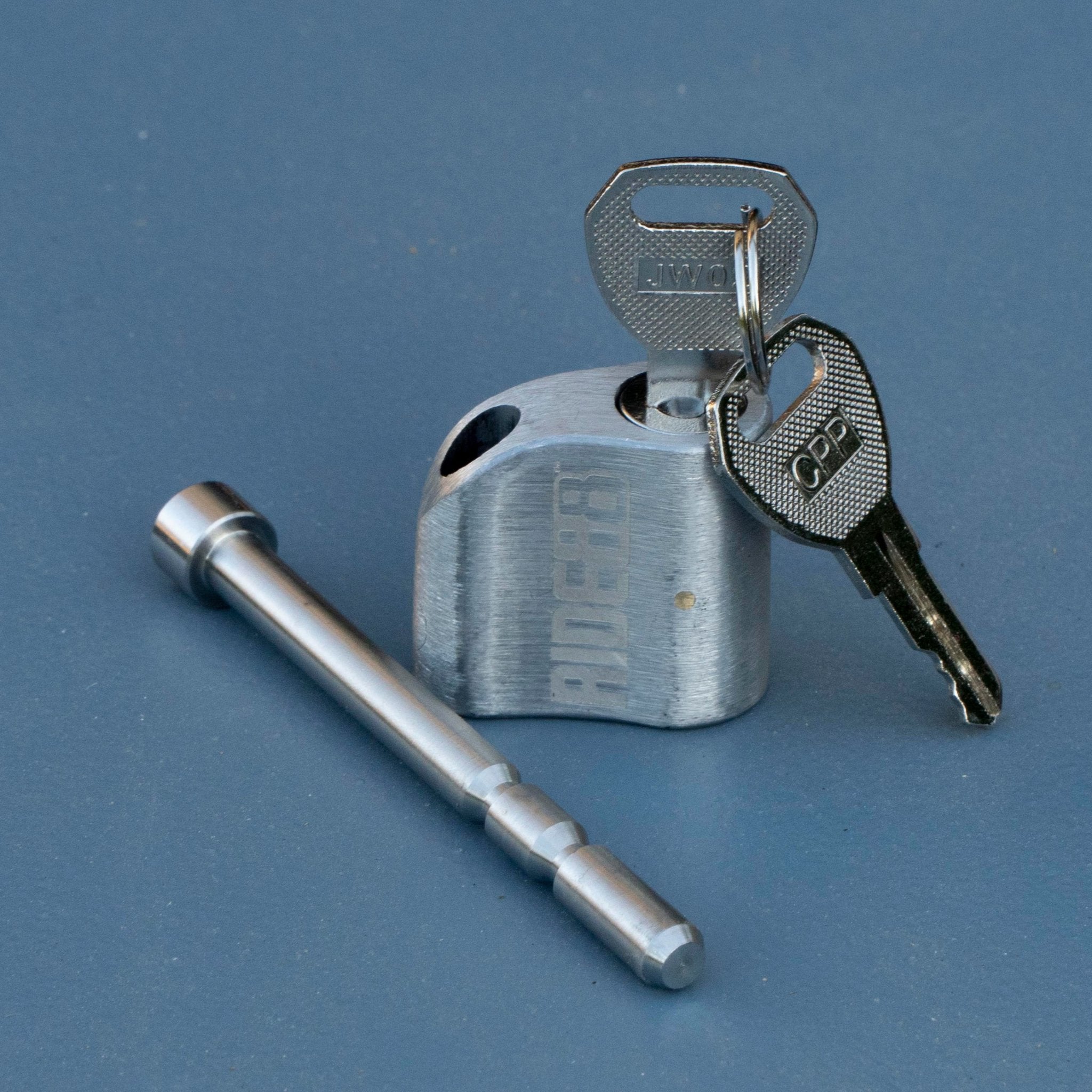 RIDE88 stainless steel locking pin and key set for securing QR3 Bike Rack and Telescopic Crossbar, precision-machined for truck bed bike rack security.