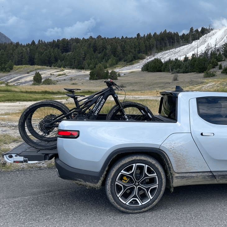 Two bikes in the bed of a truck using the QR3 Bike Rack for Rivian R1T.