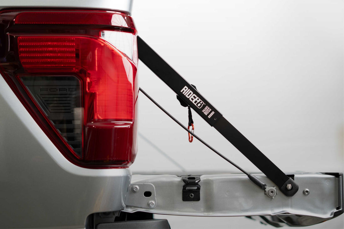 RIDE88 Tailgate Boss truck bed support bar mounted on a pickup, securing tailgate from bouncing.
