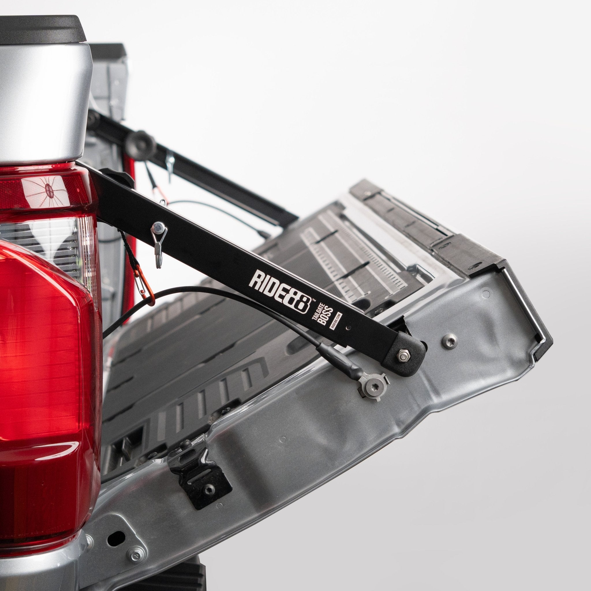RIDE88 Tailgate Boss Pro installed on a truck holding a tailgate up at 45 degrees.