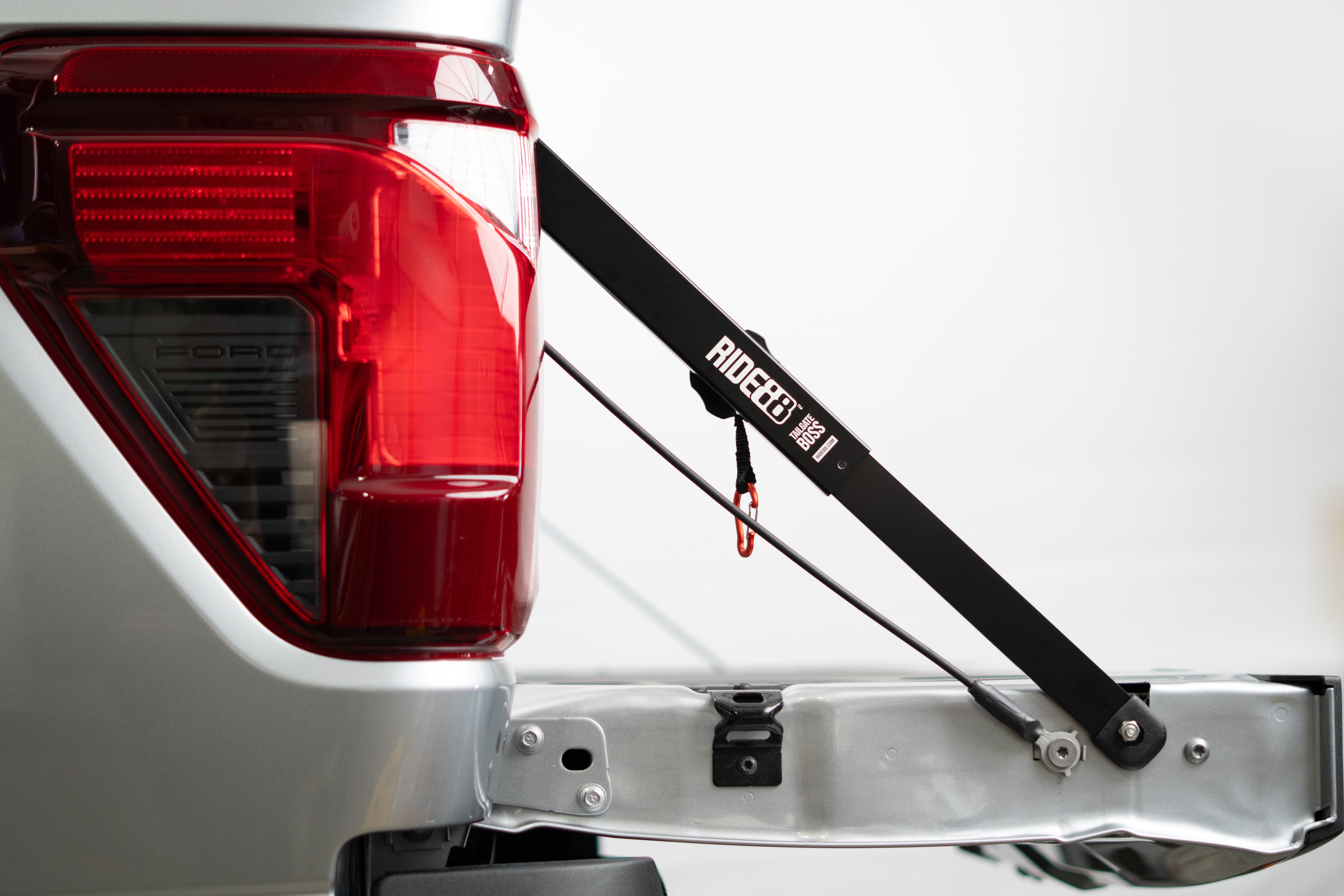 Load video: RIDE88 Tailgate Boss demonstrated on a truck with a bouncing tailgate. After installation, the bouncing stops.