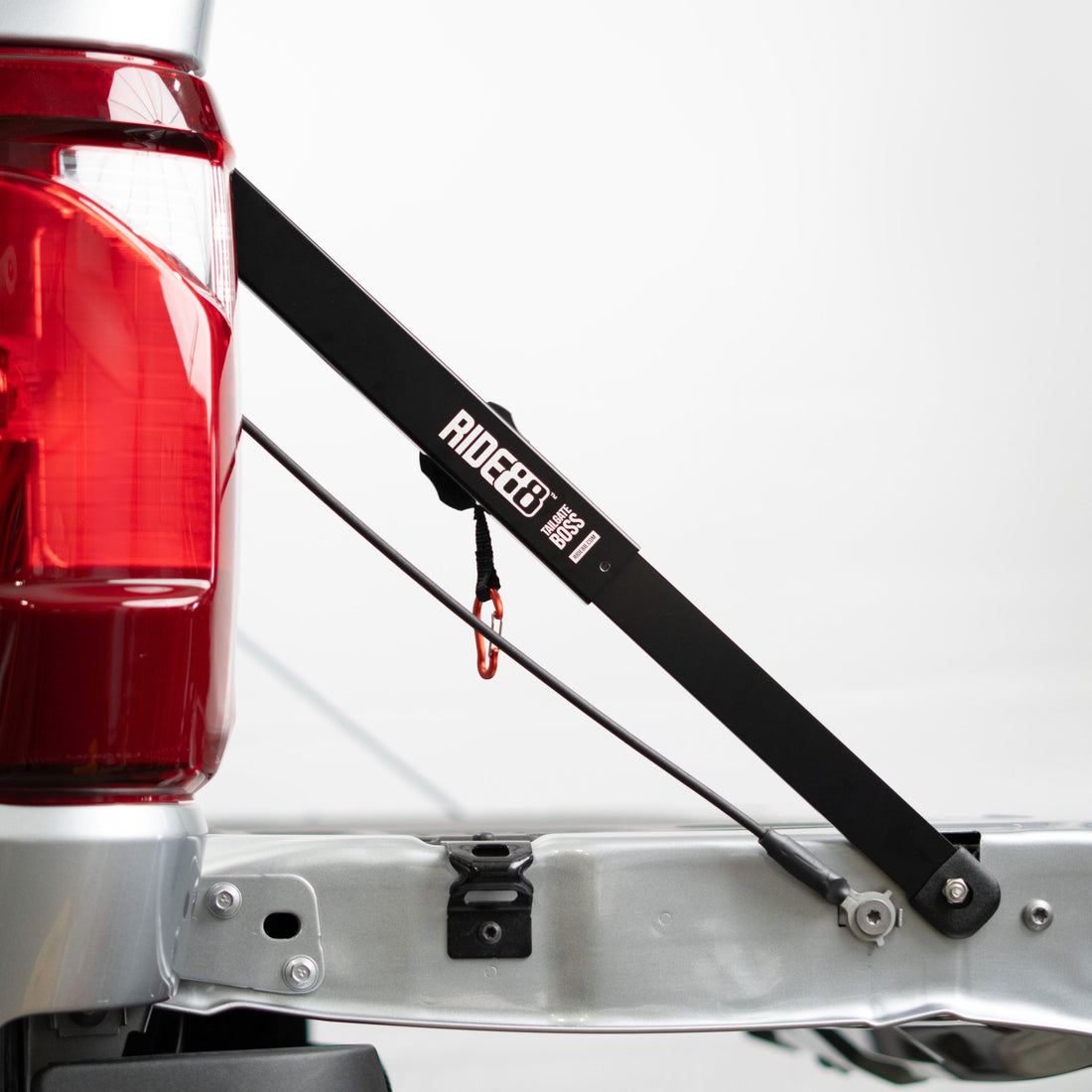 RIDE88 Tailgate Boss truck bed support bar mounted on a pickup, securing tailgate from bouncing.